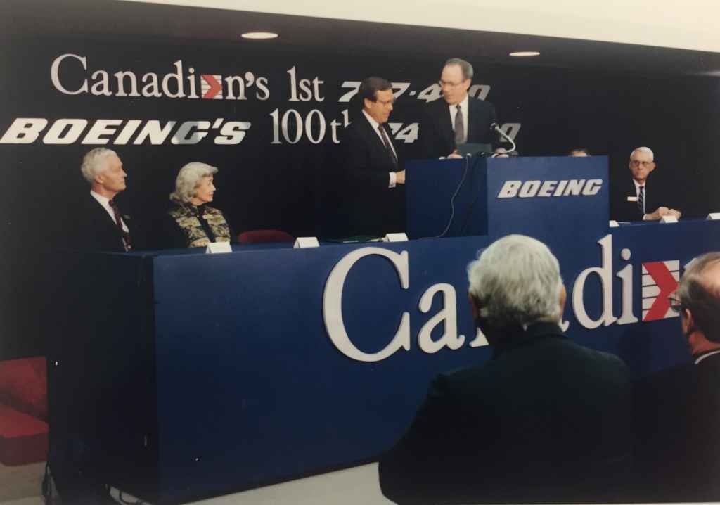 CAIL Chief Executive Rhys Eyton on the podium. This was the special handover ceremony of Canadian Airlines' first Boeing 747-475 "Maxwell Ward" at Boeing Field, December 13, 1990, prior to delivery to Vancouver. The video of this event stream at http://www.jetflix.tv