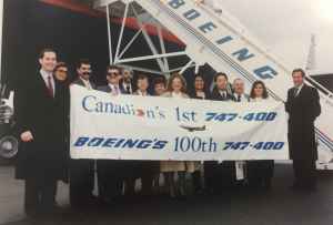 Canadian Airlines Boeing 747-475 "Maxwell Ward" with staff flanked by Kevin Jenkins and Rhys Eyton at Boeing Field, December 13, 1990, prior to delivery to Vancouver.